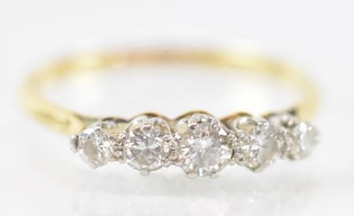 Lot 741 - An 18ct yellow gold five stone diamond ring,...