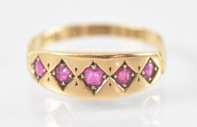 Lot 787 - A 15ct yellow gold ruby set ring, size M,...