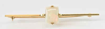 Lot 792 - A 15ct yellow gold opal set bar brooch, the...