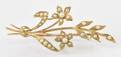 Lot 846 - A 15ct yellow gold seed pearl set floral...