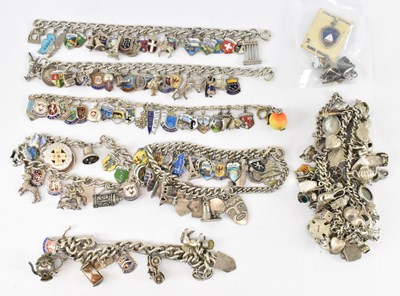 Lot 625 - Seven hallmarked silver charm bracelets, with...