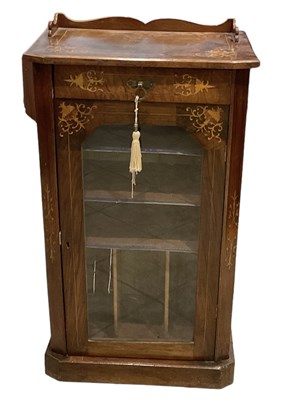 Lot 45 - A Victorian inlaid walnut music cabinet with...