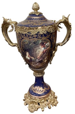 Lot 428 - A large blue and gilt porcelain trophy with...