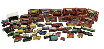 Lot 424 - A quantity of boxed model diecast vehicles...