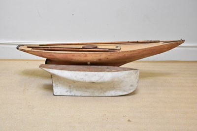 Lot 150 - A large model pond yacht, with part mast, on...