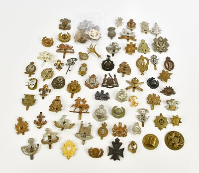 Lot 1289 - A large collection of assorted cap badges,...