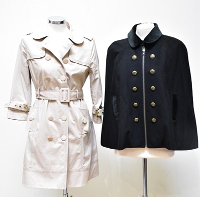 Lot 906 - JUICY COUTURE; a short beige fitted trench...