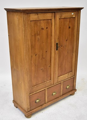 Lot 54 - An early 20th century pine side cabinet with...