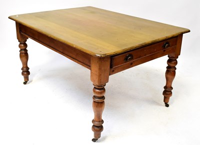 Lot 26 - An early 20th century pine kitchen table, 75 x...