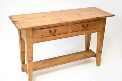Lot 28 - A contemporary pine two-drawer side table,...