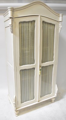 Lot 84 - LAURA ASHLEY; a white painted armoire with a...