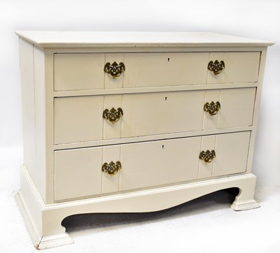 Lot 38 - A white painted chest of three drawers raised...