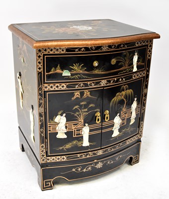 Lot 9 - A contemporary black lacquered bedside cabinet...