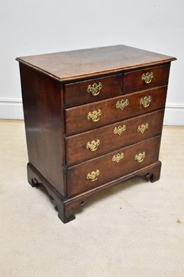 Lot 1015 - An 18th century style oak chest of two short...