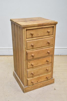 Lot 1159 - A pine chest of six drawers, on plinth base,...