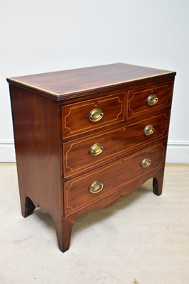 Lot 1030 - A Georgian inlaid mahogany chest of two short...