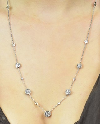 Lot 1080 - An 18ct white gold diamond set necklace with...