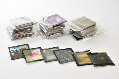 Lot 1498 - A collection of sixty-six magic lantern slides,...
