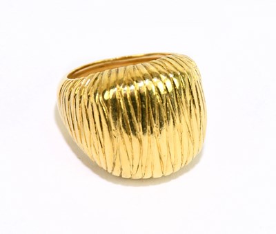 Lot 1040 - A yellow metal textured signet ring stamped...