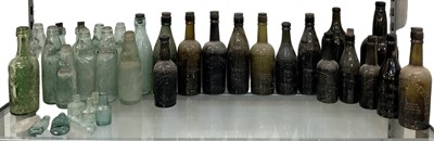 Lot 486 - Twenty-eight assorted glass bottles, all named,...