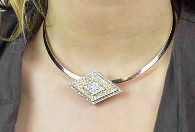 Lot 1102 - An 18ct white gold collar supporting a yellow...