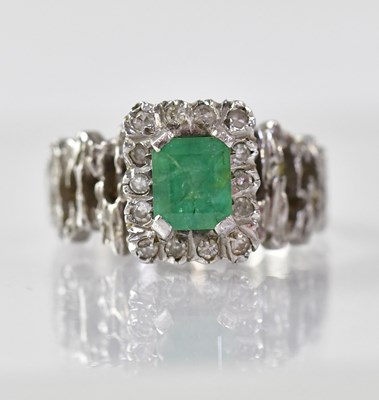 Lot 912 - An emerald and diamond set 18ct white gold...