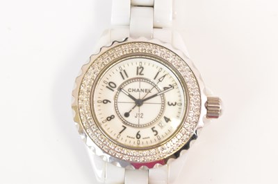 Lot 1322 - CHANEL; a J12 wristwatch with white ceramic...