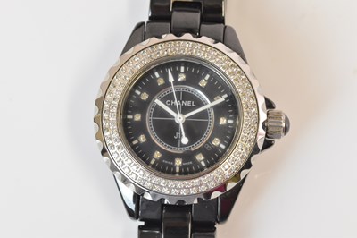 Lot 1323 - CHANEL; a J12 wristwatch with black ceramic...