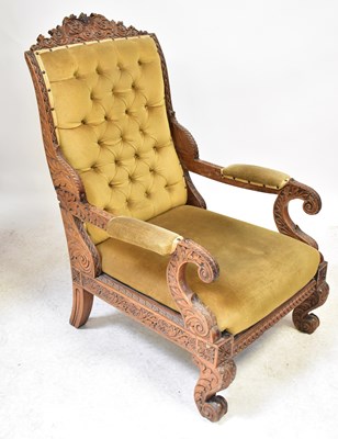 Lot 77 - A 19th century carved walnut armchair with...