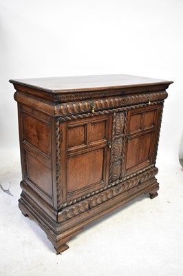 Lot 67 - An 18th century oak cabinet with double...