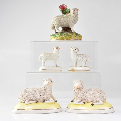 Lot 305 - Five Staffordshire and other models of sheep,...