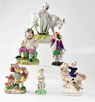 Lot 303 - A collection of ceramic figures to include a...