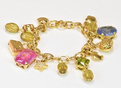 Lot 1117 - An 18ct yellow gold charm bracelet with hoop...