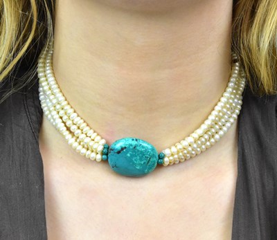 Lot 1129 - A four strand cultured pearl, turquoise and...