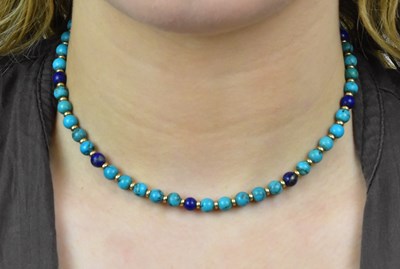 Lot 1130 - An 18ct yellow gold turquoise and lapis lazuli...