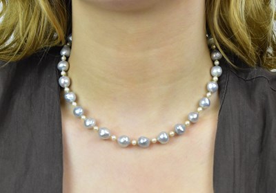 Lot 1136 - An Akoya and cultured pearl bead necklace with...