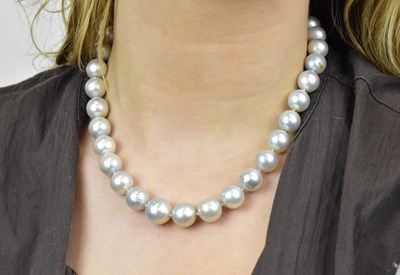 Lot 1143 - A hand tied pearl necklace with 18ct white...