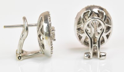 Lot 1153 - A pair of 18ct white gold and diamond earrings,...