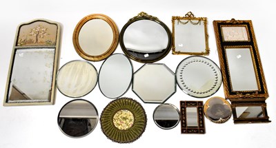 Lot 103 - A collection of variously sized wall mirrors...