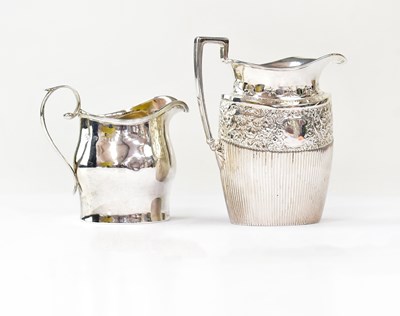 Lot 690 - Two hallmarked silver jugs comprising one with...