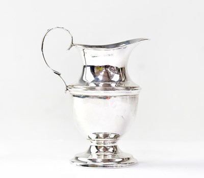 Lot 689 - A George V hallmarked silver cream jug with...