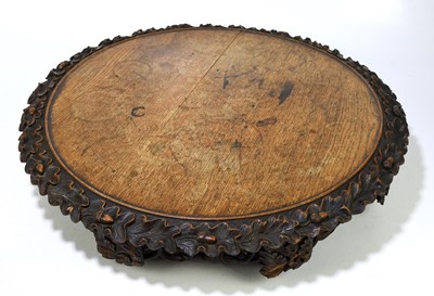 Lot 106 - A 19th century carved oak Lazy Susan, the...