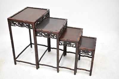 Lot 12 - A Chinese hardwood quartetto, each table...