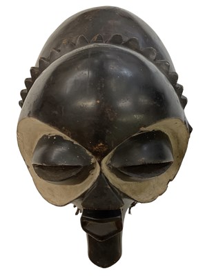 Lot 579 - A Pende mask, with white painted and carved...