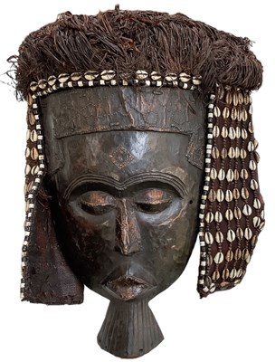 Lot 564 - A tribal Kuba Lele mask, with beaded and shell...