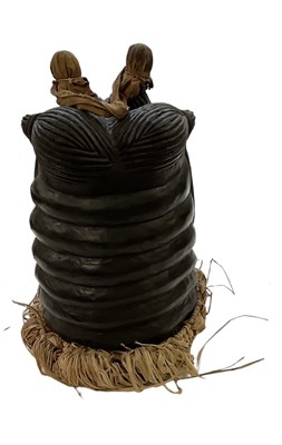 Lot 574 - An African carved wooden Mende mask with straw...