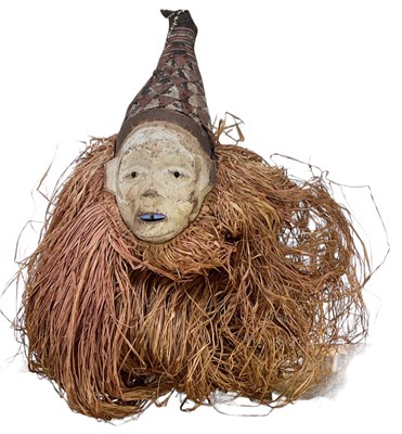 Lot 550 - A Congo carved wooden and straw mask, with...