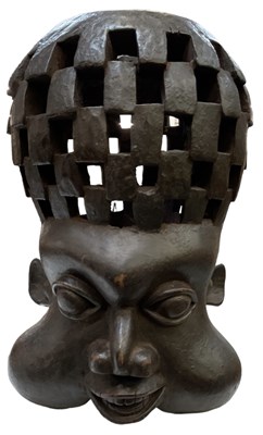 Lot 583 - An African carved wooden pot, with pierced...