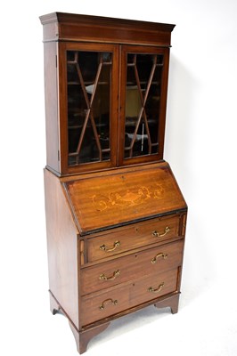 Lot 63 - An Edwardian inlaid mahogany bureau bookcase...