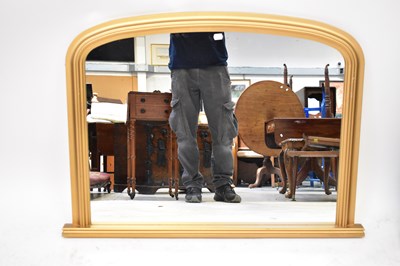 Lot 96 - A modern gilt arched top overmantel mirror, 72...